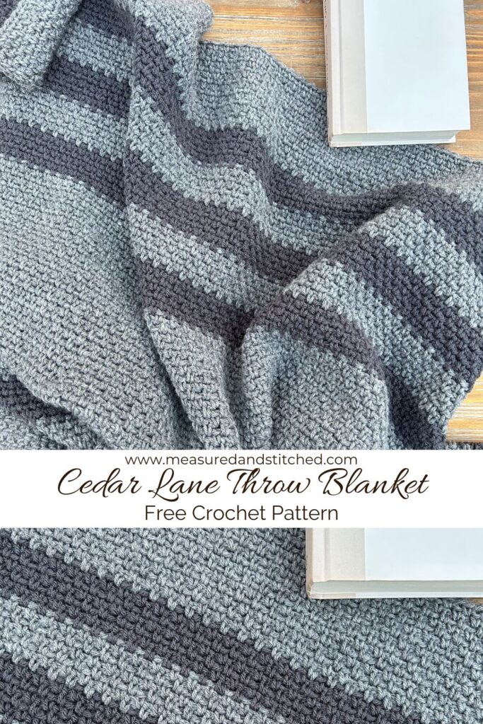 Striped gray throw blanket with book, www.measuredandstitched.com, Cedar Lane Throw Blanket, Free Crochet Pattern