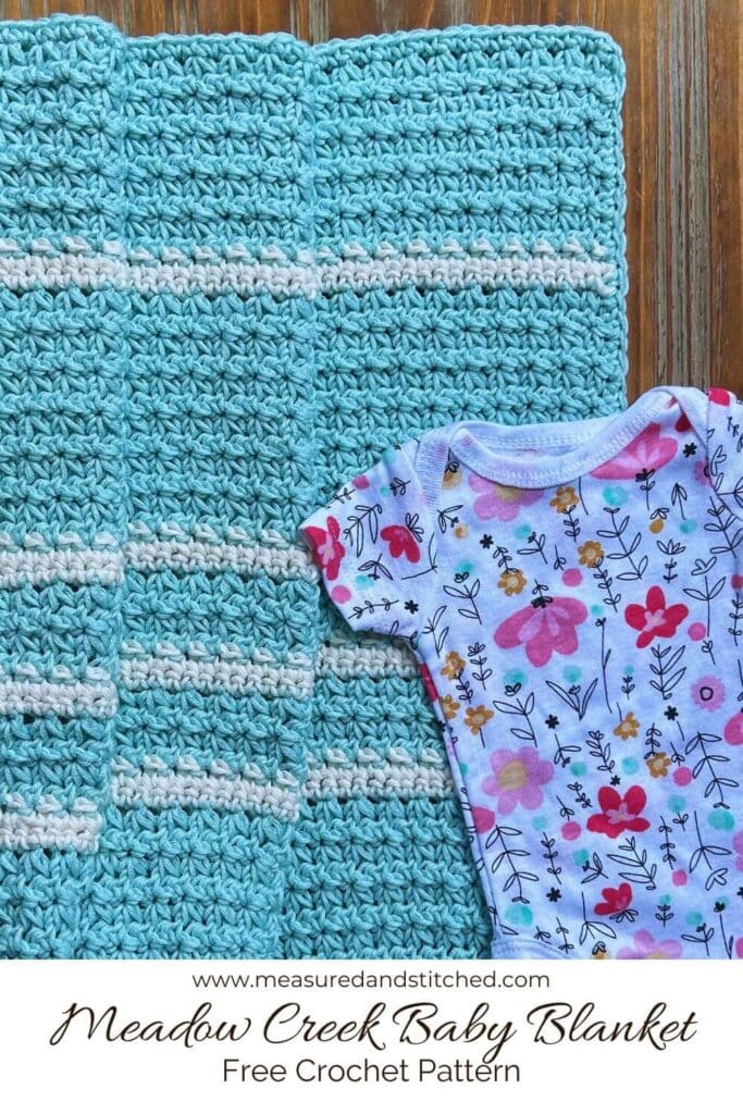 blue and white trinity stitch baby blanket with baby outfit, Meadow Creek Baby Blanket, Free Crochet Pattern, www.measuredandstitched.com, 