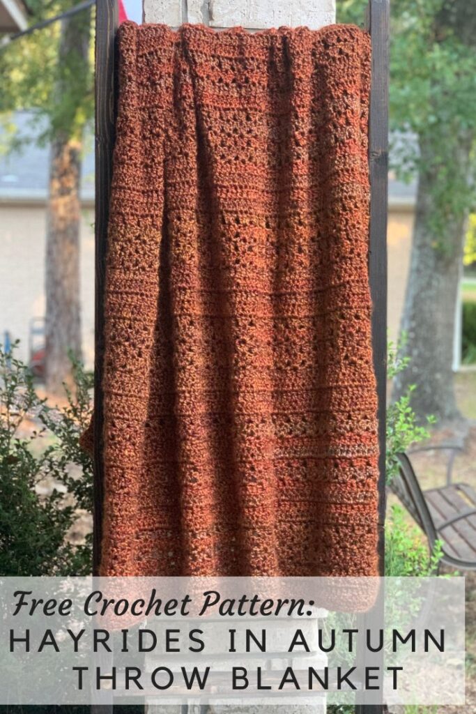chunky crochet throw blanket on outdoor blanket ladder, overlay text says "Free Crochet Pattern: Hayrides in Autumn Throw Blanket"