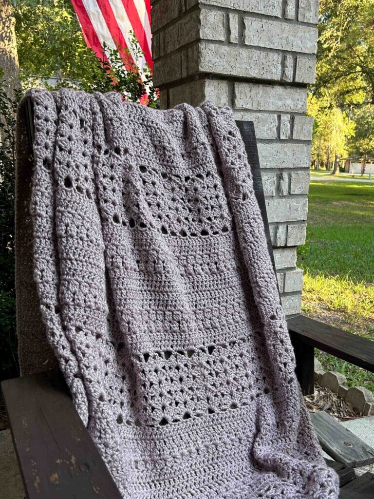 light-colored rustic throw blanket on outdoor chair
