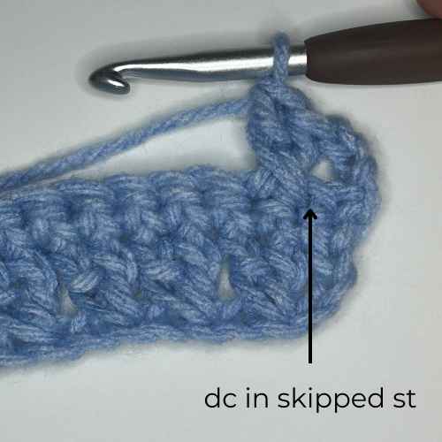 example of how to dc in skipped st, overlay text says "dc in skipped st"