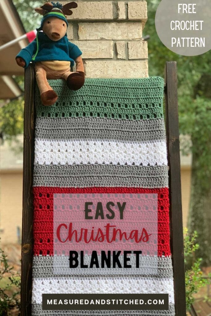 Christmas throw blanket on blanket ladder with stuffed moose, overlay text says "Easy Christmas Blanket, measuredandstitched.com, Free Crochet Pattern"