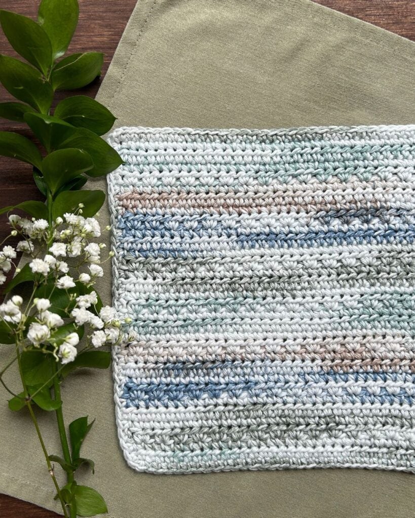 crochet dishcloth with flowers and greenery