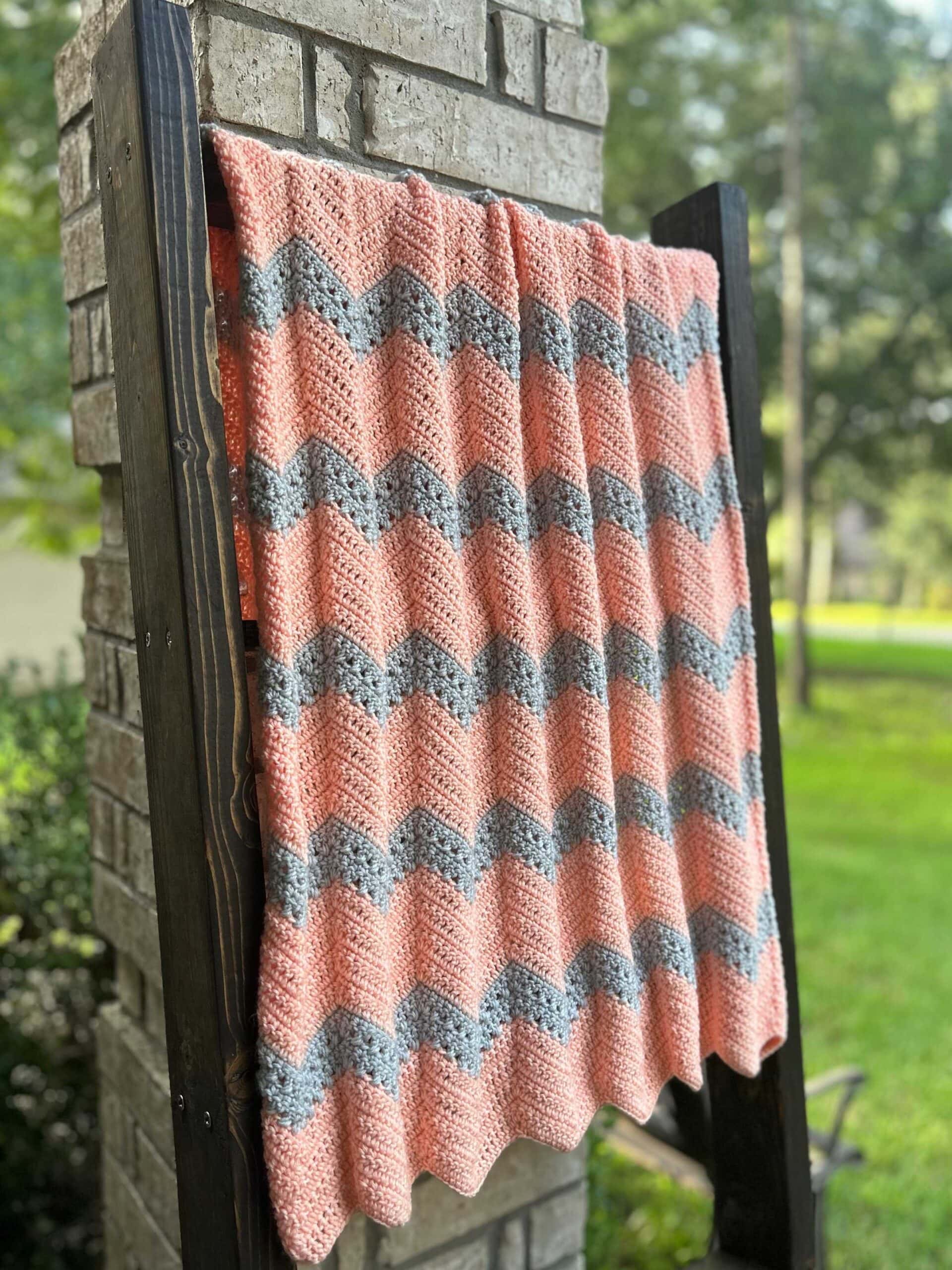 crochet baby blanket on outdoor blanket ladder