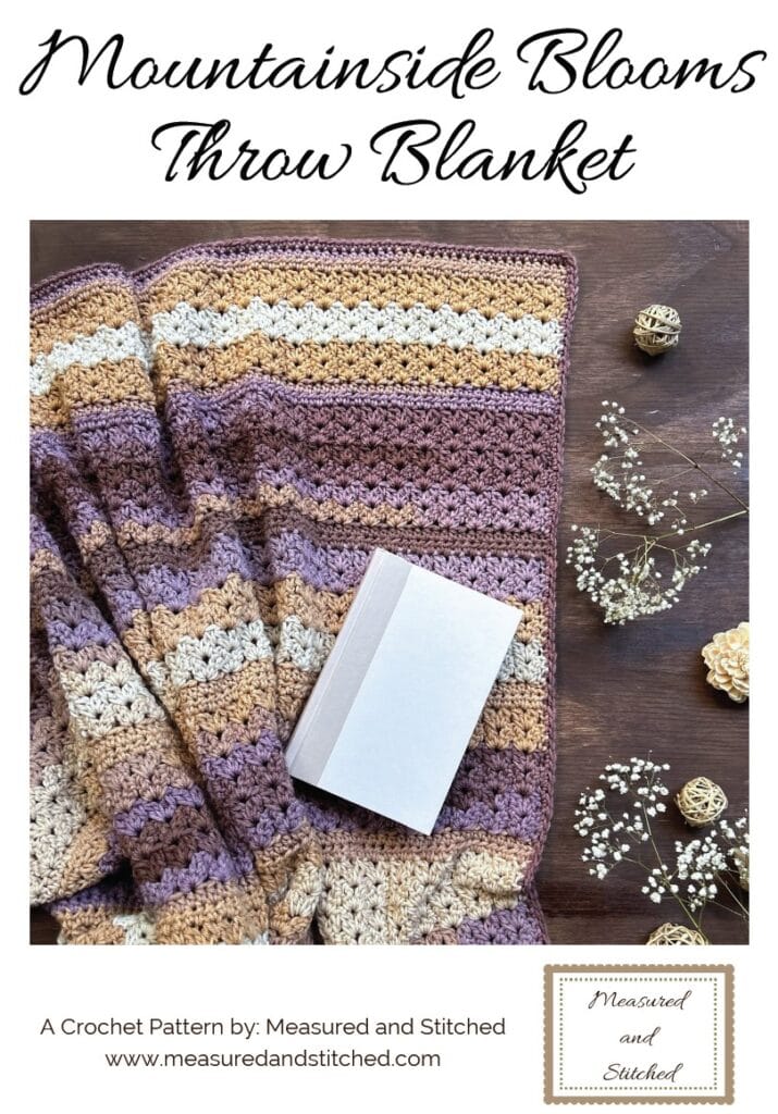throw blanket with book, overlay text reads "Mountainside Blooms Throw Blanket, a crochet pattern by Measured and Stitched, www.measuredandstitched.com"