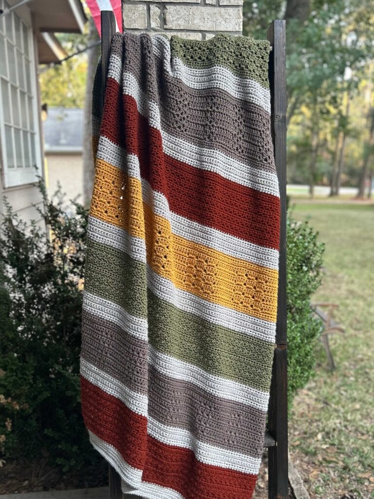 fall colored throw blanket on blanket ladder
