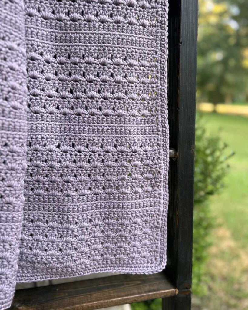 closeup of shell stitch throw blanket on a blanket ladder