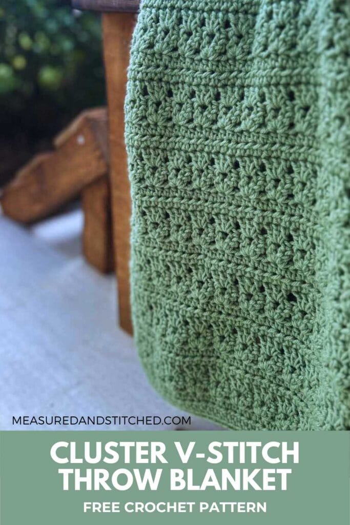 textured throw blanket with cluster v-stitch on outdoor chair. Text reads "measuredandstitched.com, cluster v-stitch throw blanket, free crochet pattern"