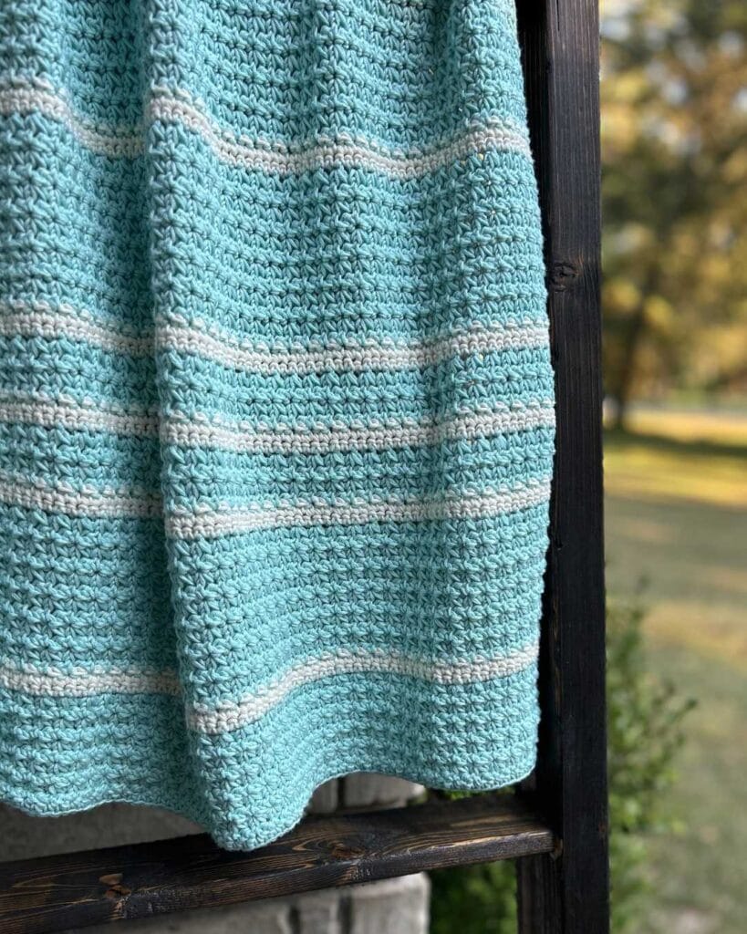 crochet blanket on outdoor blanket ladder