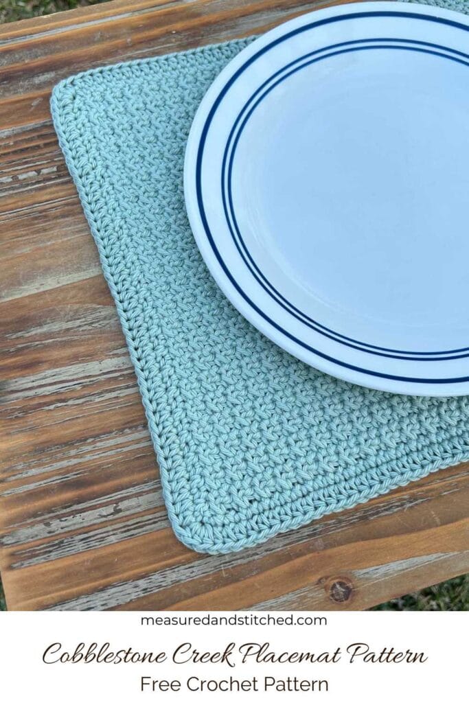 crochet placemat and plate, text reads "measuredandstitched.com, Cobblestone Creek Placemat Pattern, Free Crochet Pattern"